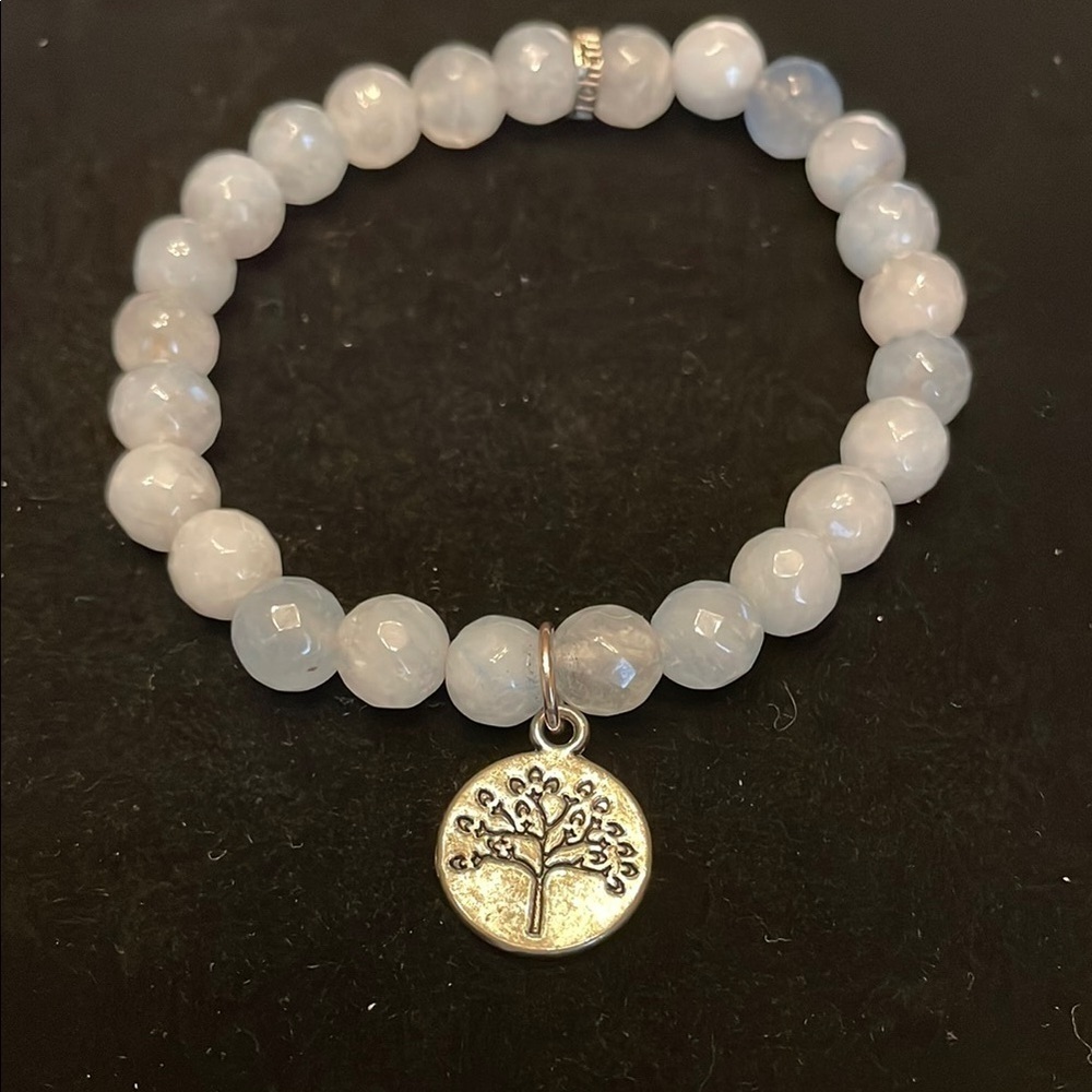 Elegant Silver tone and light blue bead Charm Bracelet